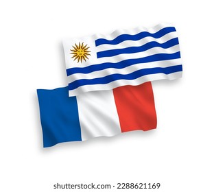 National vector fabric wave flags of France and Oriental Republic of Uruguay isolated on white background. 1 to 2 proportion.