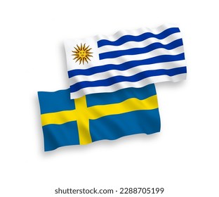 National vector fabric wave flags of Sweden and Oriental Republic of Uruguay isolated on white background. 1 to 2 proportion.