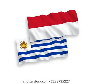 Banderas de ondulación de tela vectorial nacional de Indonesia y la República Oriental del Uruguay aisladas de fondo blanco. de 1 a 2.