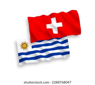 Banderas de olas de tela vectorial nacional de la República Oriental del Uruguay y Suiza aisladas en fondo blanco. de 1 a 2.