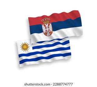 National vector fabric wave flags of Oriental Republic of Uruguay and Serbia isolated on white background. 1 to 2 proportion.