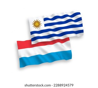 National vector fabric wave flags of Oriental Republic of Uruguay and Luxembourg isolated on white background. 1 to 2 proportion.