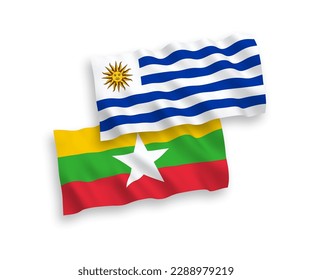 National vector fabric wave flags of Oriental Republic of Uruguay and Myanmar isolated on white background. 1 to 2 proportion.