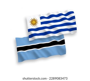 Banderas de olas de tela vectorial nacional de la República Oriental del Uruguay y Botswana aisladas en fondo blanco. de 1 a 2.
