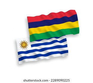National vector fabric wave flags of Oriental Republic of Uruguay and Republic of Mauritius isolated on white background. 1 to 2 proportion.