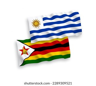 Banderas de olas de tela vectorial nacional de la República Oriental del Uruguay y Zimbabwe aisladas en fondo blanco. de 1 a 2.