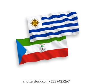 National vector fabric wave flags of Oriental Republic of Uruguay and Republic of Equatorial Guinea isolated on white background. 1 to 2 proportion.