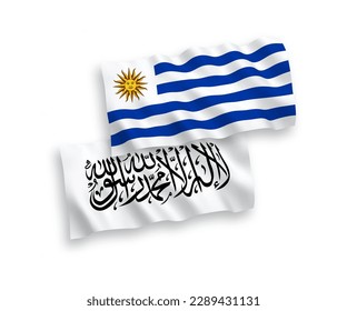 National vector fabric wave flags of Oriental Republic of Uruguay and Islamic Emirate of Afghanistan isolated on white background. 1 to 2 proportion.