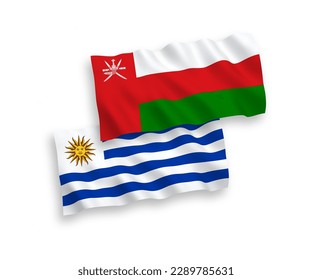 National vector fabric wave flags of Oriental Republic of Uruguay and Sultanate of Oman isolated on white background. 1 to 2 proportion.