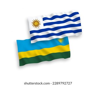 Banderas de ondulación de tela vectorial nacional de la República Oriental del Uruguay y la República de Rwanda aisladas de fondo blanco. de 1 a 2.