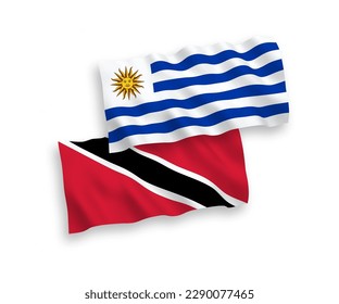 Nationale Vektorgrafik-Wellen-Flaggen der Orientalischen Republik Uruguay und der Republik Trinidad und Tobago einzeln auf weißem Hintergrund. 1 bis 2 %.