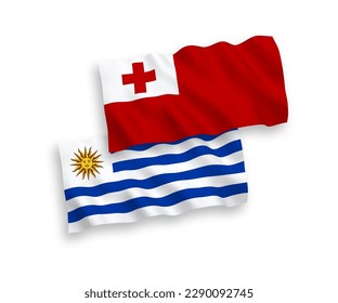 National vector fabric wave flags of Oriental Republic of Uruguay and Kingdom of Tonga isolated on white background. 1 to 2 proportion.