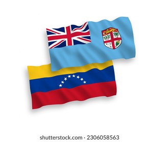 National vector fabric wave flags of Venezuela and Republic of Fiji isolated on white background. 1 to 2 proportion.