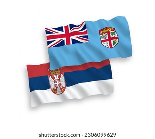 National vector fabric wave flags of Republic of Fiji and Serbia isolated on white background. 1 to 2 proportion.