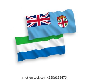 National vector fabric wave flags of Republic of Fiji and Sierra Leone isolated on white background. 1 to 2 proportion.