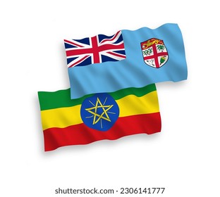 National vector fabric wave flags of Republic of Fiji and Ethiopia isolated on white background. 1 to 2 proportion.