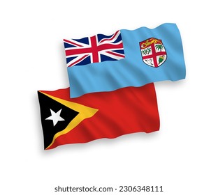 National vector fabric wave flags of Republic of Fiji and East Timor isolated on white background. 1 to 2 proportion.