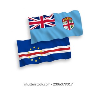 National vector fabric wave flags of Republic of Fiji and Republic of Cabo Verde isolated on white background. 1 to 2 proportion.