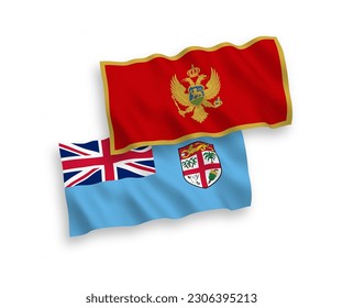 National vector fabric wave flags of Republic of Fiji and Montenegro isolated on white background. 1 to 2 proportion.