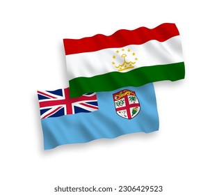 National vector fabric wave flags of Republic of Fiji and Tajikistan isolated on white background. 1 to 2 proportion.