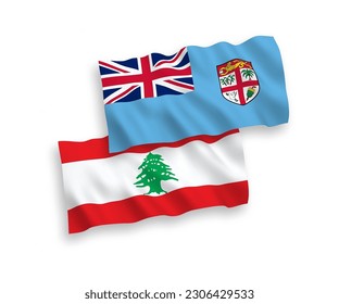 National vector fabric wave flags of Republic of Fiji and Lebanon isolated on white background. 1 to 2 proportion.