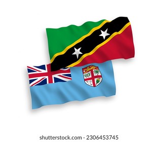 National vector fabric wave flags of Republic of Fiji and Federation of Saint Christopher and Nevis isolated on white background. 1 to 2 proportion.