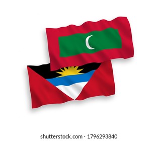National vector fabric waving flags of Maldives and Antigua and Barbuda isolated on white background. 1 to 2 proportion.