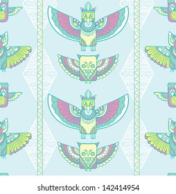 Native american indigenous ornamental seamless pattern background with feathers and totem poles.