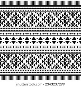 Native pattern design in geometric abstract style of tribal Aztec and Navajo. Seamless ethnic pattern design for textile and fabric print. Black and white colors.