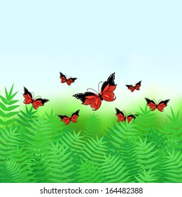 Natural background with butterflies flying over grass