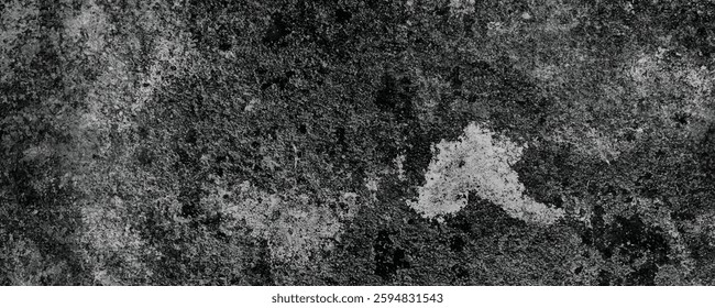The Natural Erosion of a Dark and Scratched Cement Wall Creating an Abstract Pattern
