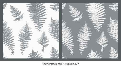 Silhouettes de impresión natural de hojas de hierro. Conjunto de vectores de patrones monocromos sin foco con impronta de plantas forestales. Fondo Floral. El sello Fern deja papel pintado de época. Colores blancos grises.