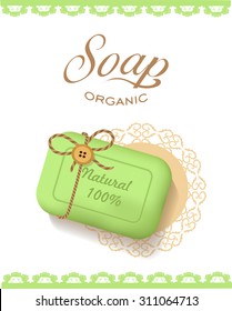 Natural green soap with the inscription on lacy napkin