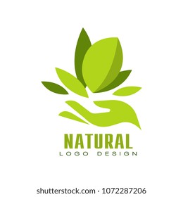 Natural logo design, healthy premium quality label with green leaves and human hand, emblem for cafe, packaging, restaurant, farm products vector Illustration on a white background