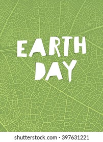 Nature background with "Earth day" headline. Green leaf veins texture. Paper cut letters.