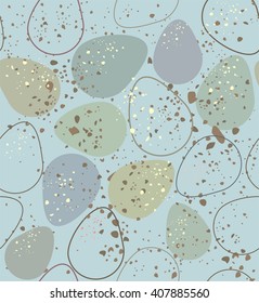 Nature eggs mottled.  A seamless pattern of eggs mottled, bluish, gray-green, beige and contour on a gray-blue background.