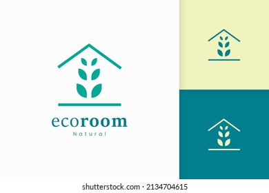 Nature green house logo with tree and leaf shape