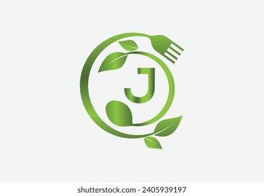 Nature and latter J with frok and spoon and healthy food