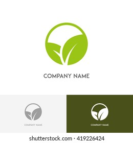 Nature logo - fresh green leaves on the white background