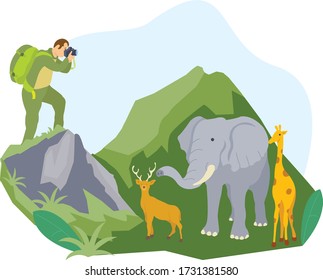 A nature photographer is photographing an elephant and deer in the middle of a safari park
