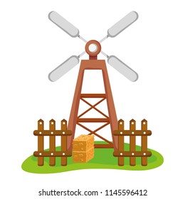 nature windmill with wood grillage and straw bale