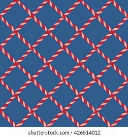 Nautical crossed rope seamless pattern. Endless navy illustration with red fishing net ornament and crossing cord on blue backdrop. Trendy maritime style background. For fabric, wallpaper, wrapping