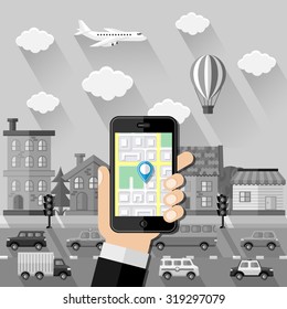 Navigation concept. Hand holds smartphone with navigation app against greyscale cityscape. Flat design. Vector illustration.