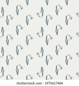 Navy blue colored snowdrop silhouettes seamless doodle pattern. Light grey background. Bloom flowers shapes. Vector illustration for seasonal textile prints, fabric, banners, backdrops and wallpapers.