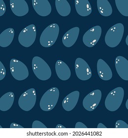 Navy blue dino eggs seamless pattern background print. Vector illustration. Great for kids and fun home decor. Easter inspired surface pattern design.