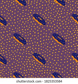 Navy blue and orange colored donats silhouettes seamless pattern. Doodle sweet fast food ornament on purple dotted background. For fabric design, textile print, wrapping, cover. Vector illustration.