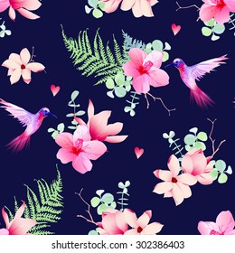 Navy pattern with tropical flowers and flying hummingbirds. Seamless vector print