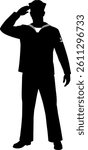 Navy sailor salutes stands in silhouette wearing uniform and hat with anchor emblem honorably