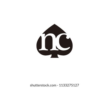 The nc initials logo inside the black shovel