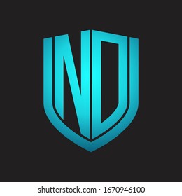 Monograma de logotipo ND con diseño de escudo de emblemas aislado con colores azules sobre fondo negro